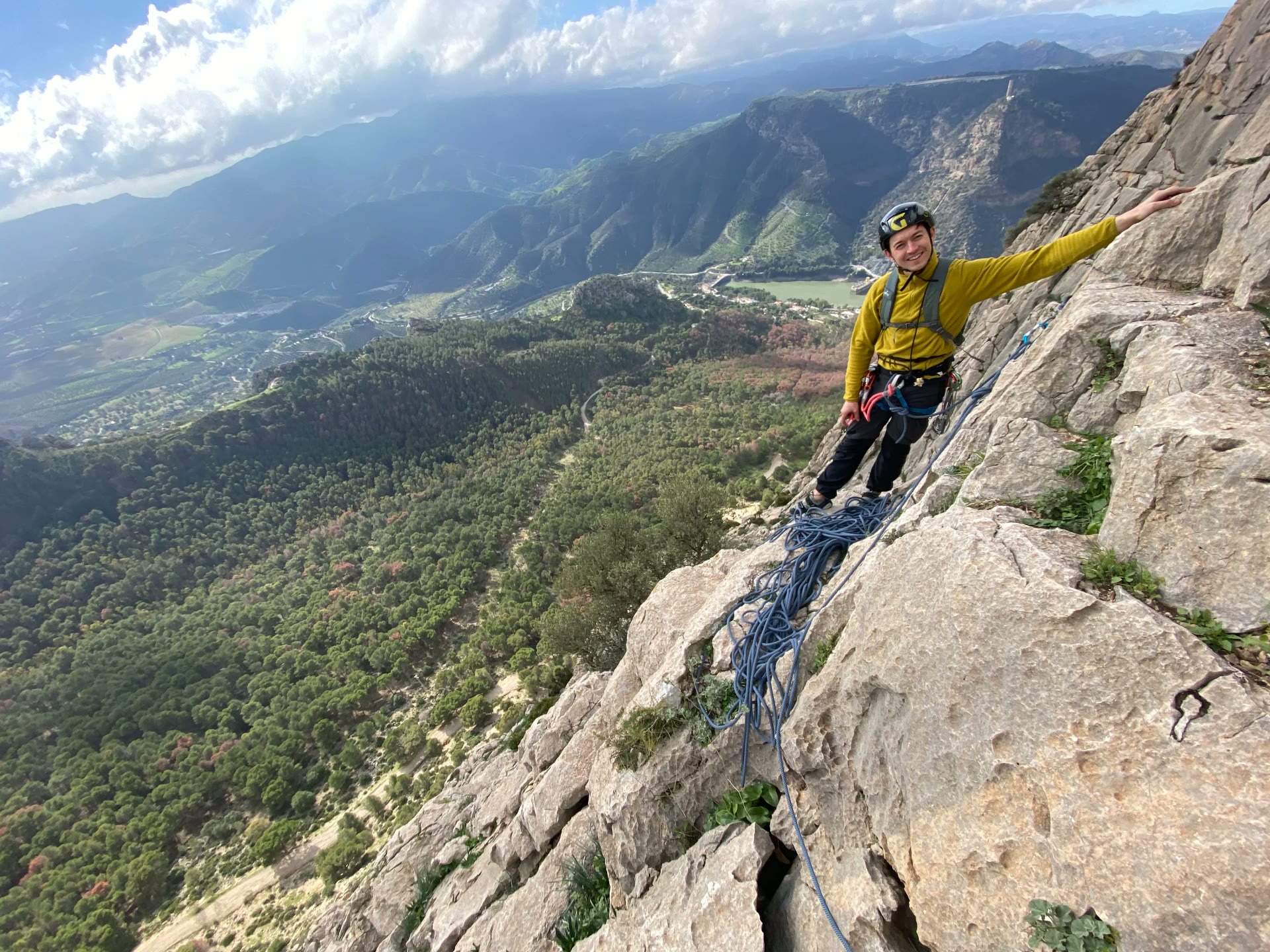 Course participant smiling on a high mountain ridge