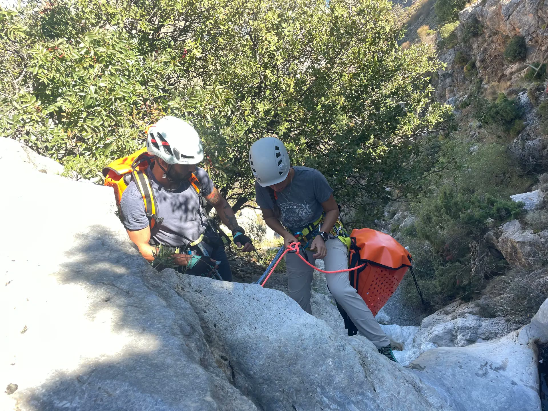 Practising rope work in a rocky canyon
